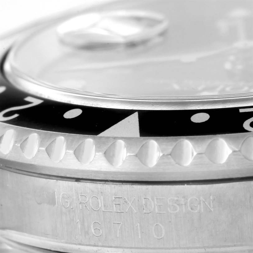 This image shows a close-up of the bezel and case of a Rolex GMT-Master 16710 Men's Stainless Steel Black Dial 16710 Men's Stainless Steel Black Dial model, highlighting the model number 16710.