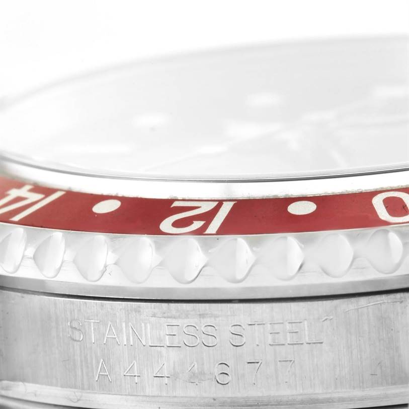 This image shows a close-up side view of the stainless steel bezel and case of a Rolex GMT-Master 16710 Men's Stainless Steel Black Dial 16710 Men's Stainless Steel Black Dial watch.