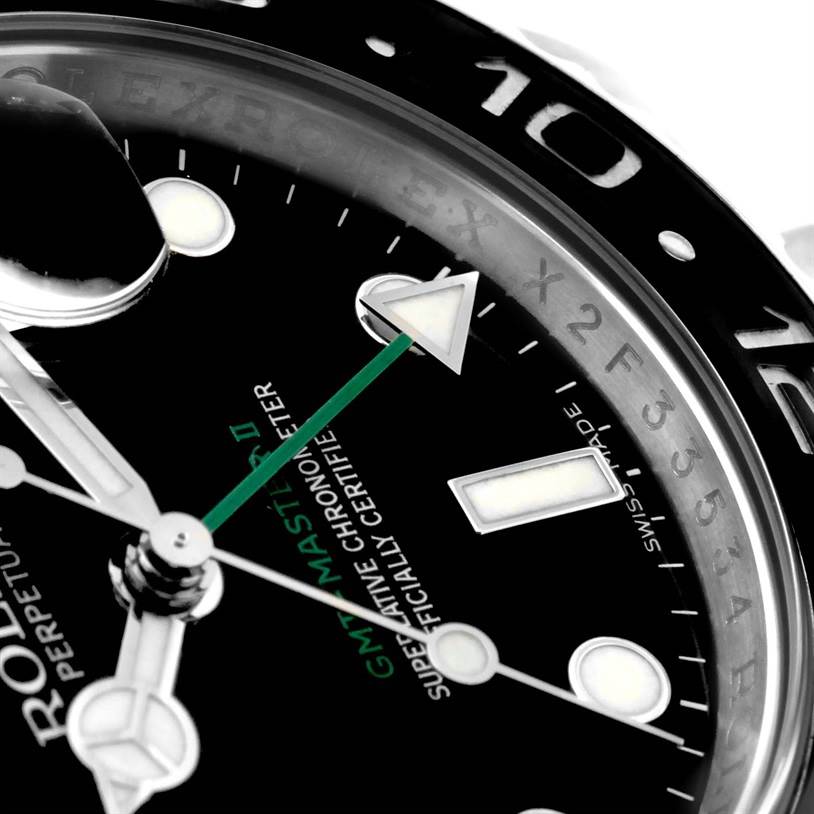 This close-up angle of the Rolex GMT-Master 116710 Men's Stainless Steel Black Dial 116710 Men's Stainless Steel Black Dial watch highlights the dial, hands, and part of the bezel.
