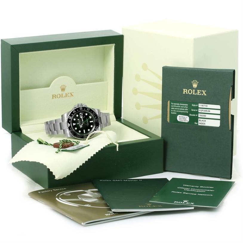 The image shows a Rolex GMT-Master 116710 Men's Stainless Steel Black Dial 116710 Men's Stainless Steel Black Dial watch displayed in an open box with accompanying booklets and tags.
