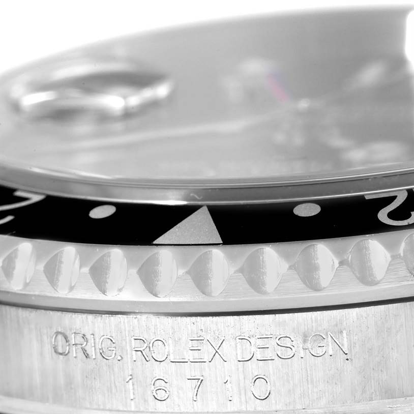 This image shows a close-up side view of the bezel and case of the Rolex GMT-Master 16710 Men's Stainless Steel Black Dial 16710 Men's Stainless Steel Black Dial model 16710.