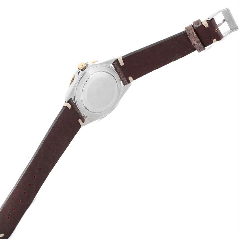 The image shows the back side of a Rolex GMT-Master 16713 Men's Stainless Steel Black Dial 16713 Men's Stainless Steel Black Dial watch with a brown leather strap, highlighting the case back and clasp.