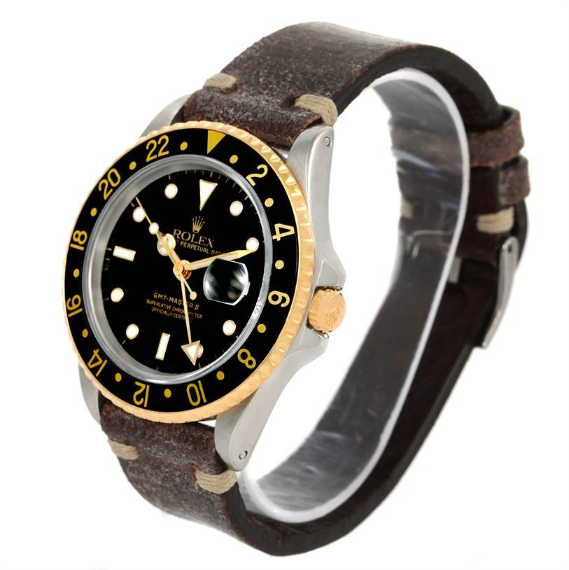 The image shows a Rolex GMT-Master 16713 Men's Stainless Steel Black Dial 16713 Men's Stainless Steel Black Dial watch from a top-front angle, highlighting its bezel, dial, and crown with a leather strap.