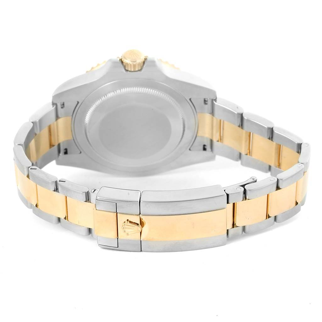 This image shows the back of a Rolex GMT-Master 116713 Men's Stainless Steel Black Dial 116713 Men's Stainless Steel Black Dial, including the case and two-tone bracelet with the clasp open.