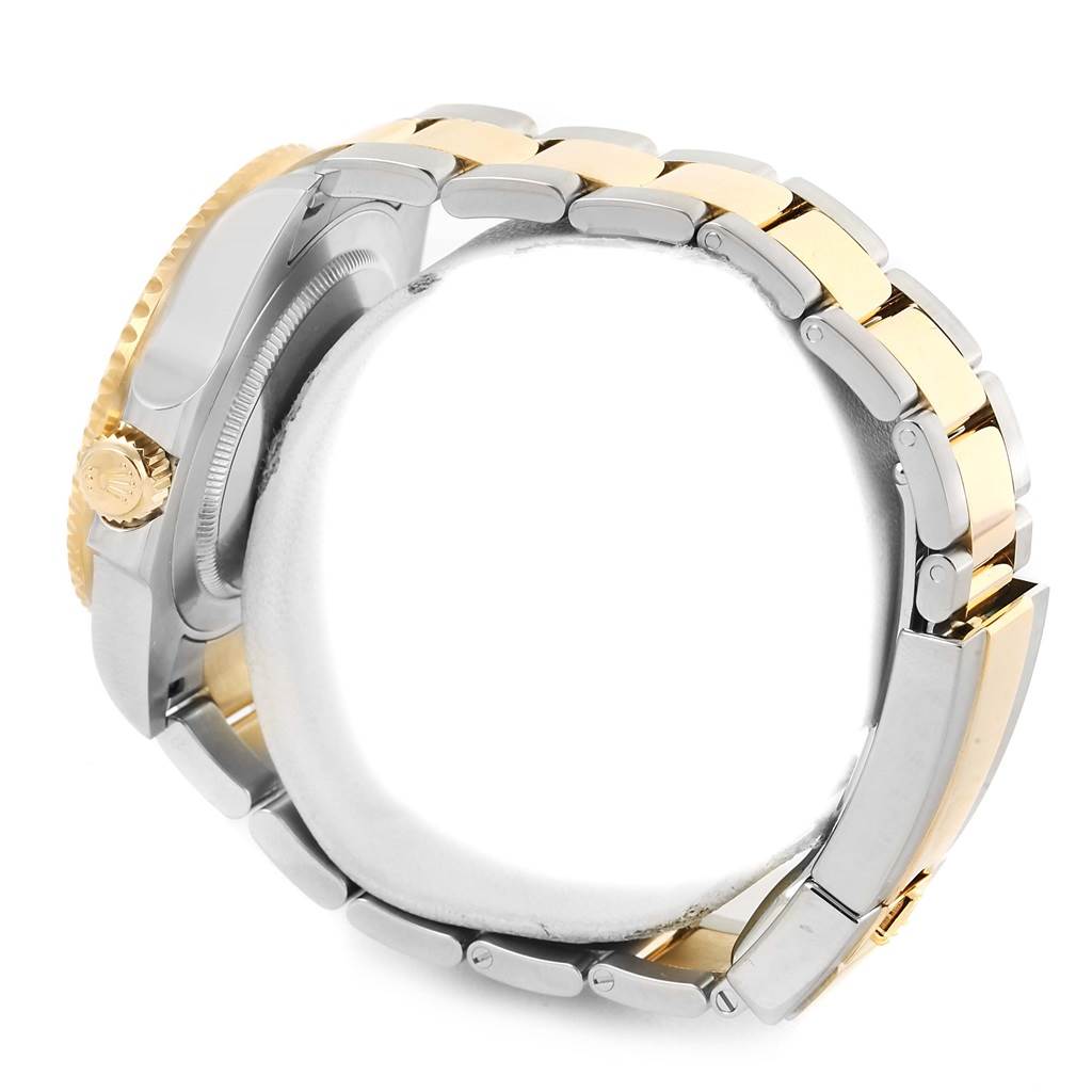 The image shows a side view of a Rolex GMT-Master 116713 Men's Stainless Steel Black Dial 116713 Men's Stainless Steel Black Dial watch, focusing on its two-tone bracelet and crown.