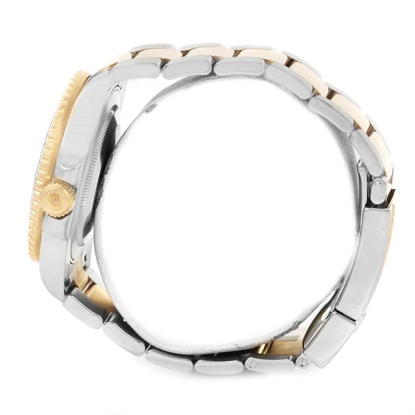 This side view shows the band and crown of the Rolex GMT-Master 116713 Men's Stainless Steel Black Dial 116713 Men's Stainless Steel Black Dial watch.