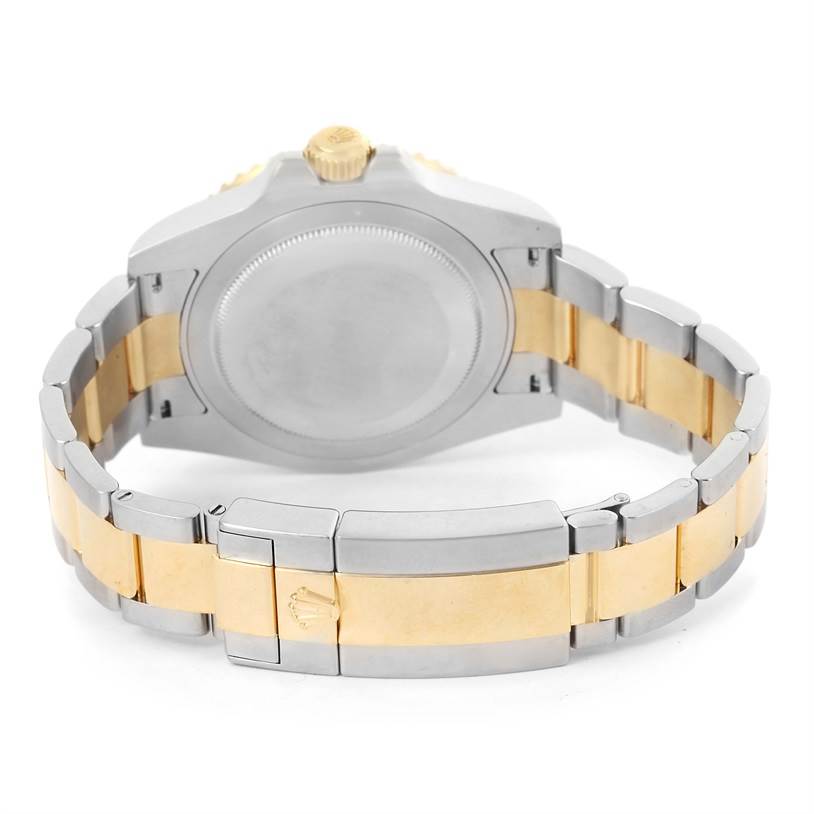 The image shows the back case and clasp of a Rolex GMT-Master 116713 Men's Stainless Steel Black Dial 116713 Men's Stainless Steel Black Dial watch, highlighting its two-tone bracelet.