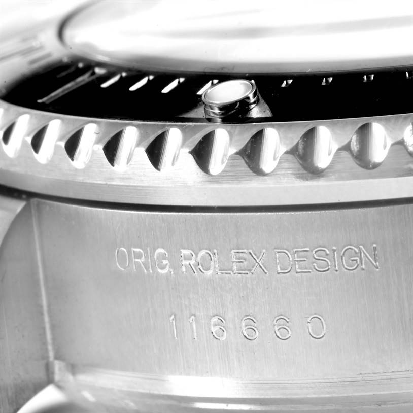 The image shows a close-up of the side of the Rolex GMT-Master 116660 Men's Stainless Steel Blue Dial 116660 Men's Stainless Steel Blue Dial watch case, displaying the "ORIG. ROLEX DESIGN" engraving with model number 116660.