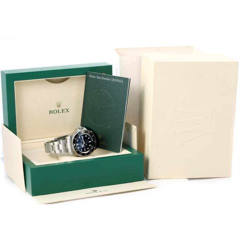 The image shows a Rolex GMT-Master 116660 Men's Stainless Steel Blue Dial 116660 Men's Stainless Steel Blue Dial watch in its open green box with an accompanying booklet, viewed from an angle above.