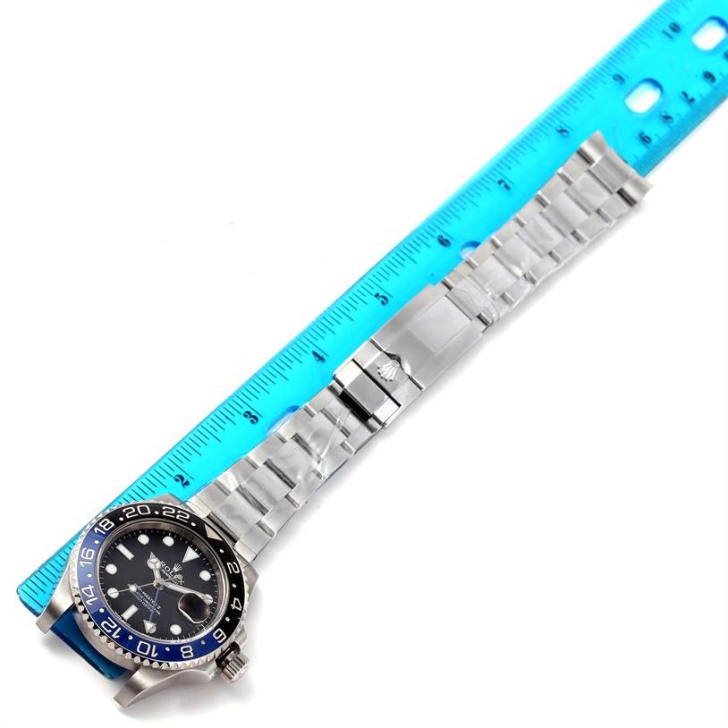 The image shows the Rolex GMT-Master 116710 Men's Stainless Steel Black Dial 116710 Men's Stainless Steel Black Dial watch face, bezel, bracelet, and clasp partially measured by a ruler.