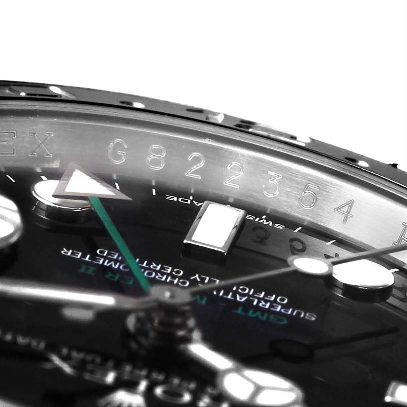 The image shows a close-up of the dial and bezel of the Rolex GMT-Master 116710 Men
s Stainless Steel Black Dial 116710 Men
s Stainless Steel Black Dial watch, focusing on the hour markers and hands.