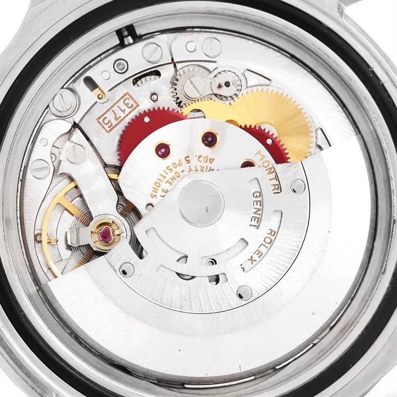 The image shows the internal mechanical movement of a Rolex GMT-Master 16700 Men
s Stainless Steel Black Dial 16700 Men
s Stainless Steel Black Dial watch taken from a close-up angle.