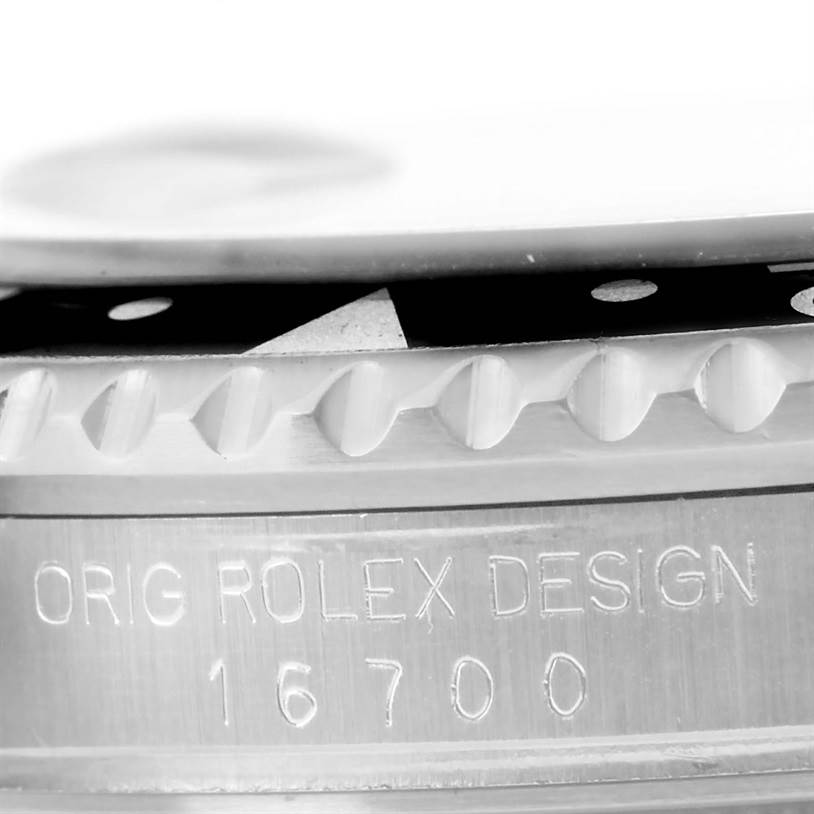 This image shows a close-up, side view of the case and bezel of a Rolex GMT-Master 16700 Men
s Stainless Steel Black Dial 16700 Men
s Stainless Steel Black Dial model 16700.