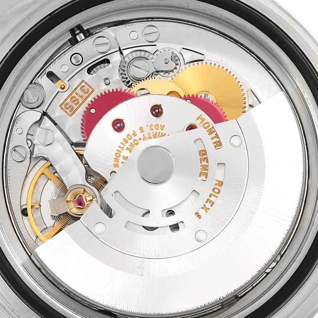 The image shows an internal view of the Rolex GMT-Master 16710 Men's Stainless Steel Black Dial 16710 Men's Stainless Steel Black Dial movement and gears from a close-up angle.