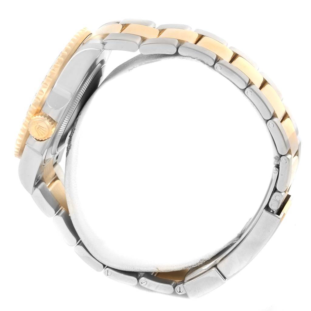 This image shows the side view of a Rolex GMT-Master 116713 Men's Stainless Steel Black Dial 116713 Men's Stainless Steel Black Dial watch, focusing on the crown and the two-tone bracelet.