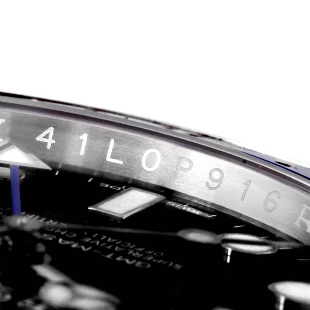 The image shows a close-up of the inner bezel and dial of a Rolex GMT-Master 116710BLNR Men's Stainless Steel Black Dial 116710BLNR Men's Stainless Steel Black Dial watch.