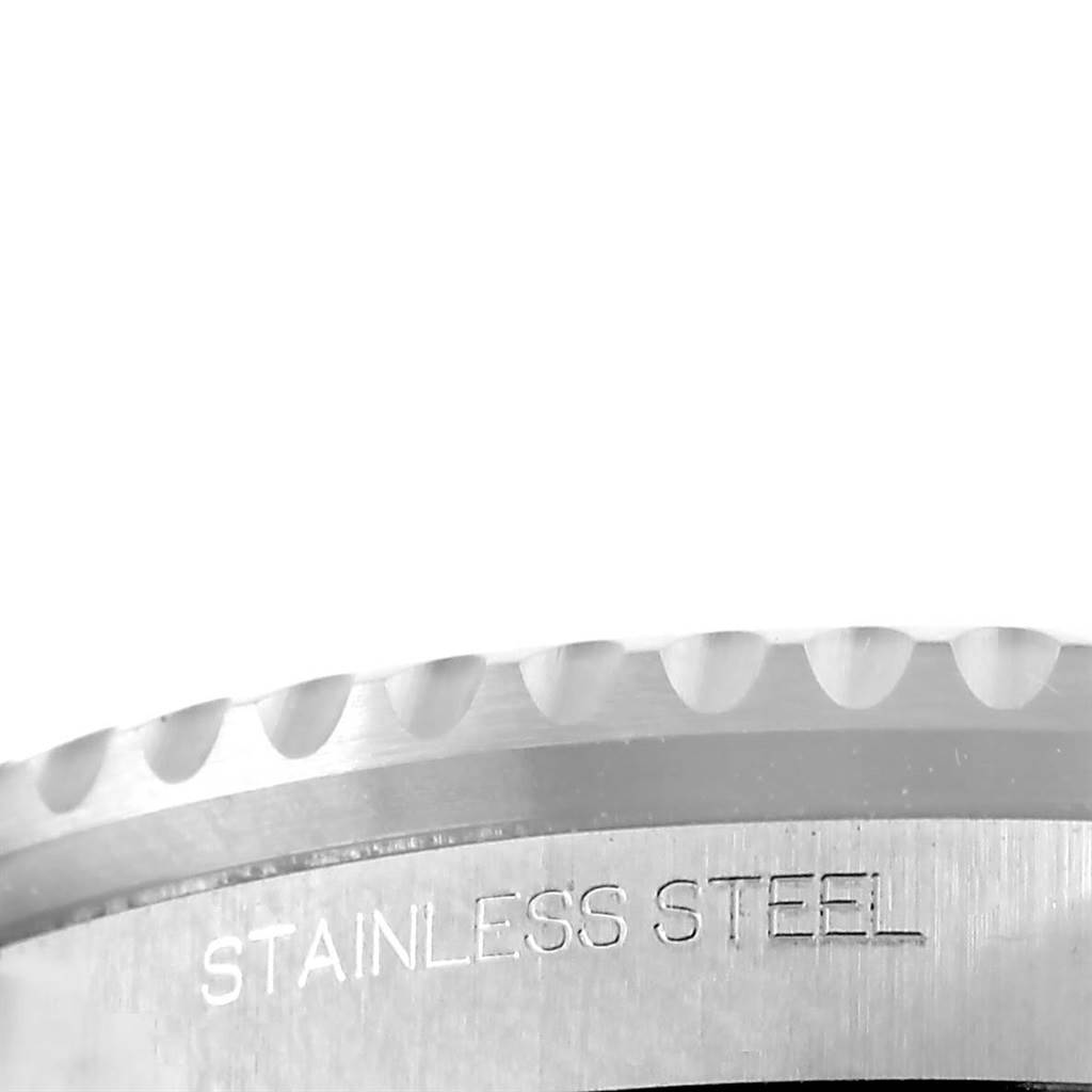 The image shows an angled close-up of the stainless steel bezel and case of a Rolex GMT-Master 116710BLNR Men's Stainless Steel Black Dial 116710BLNR Men's Stainless Steel Black Dial.