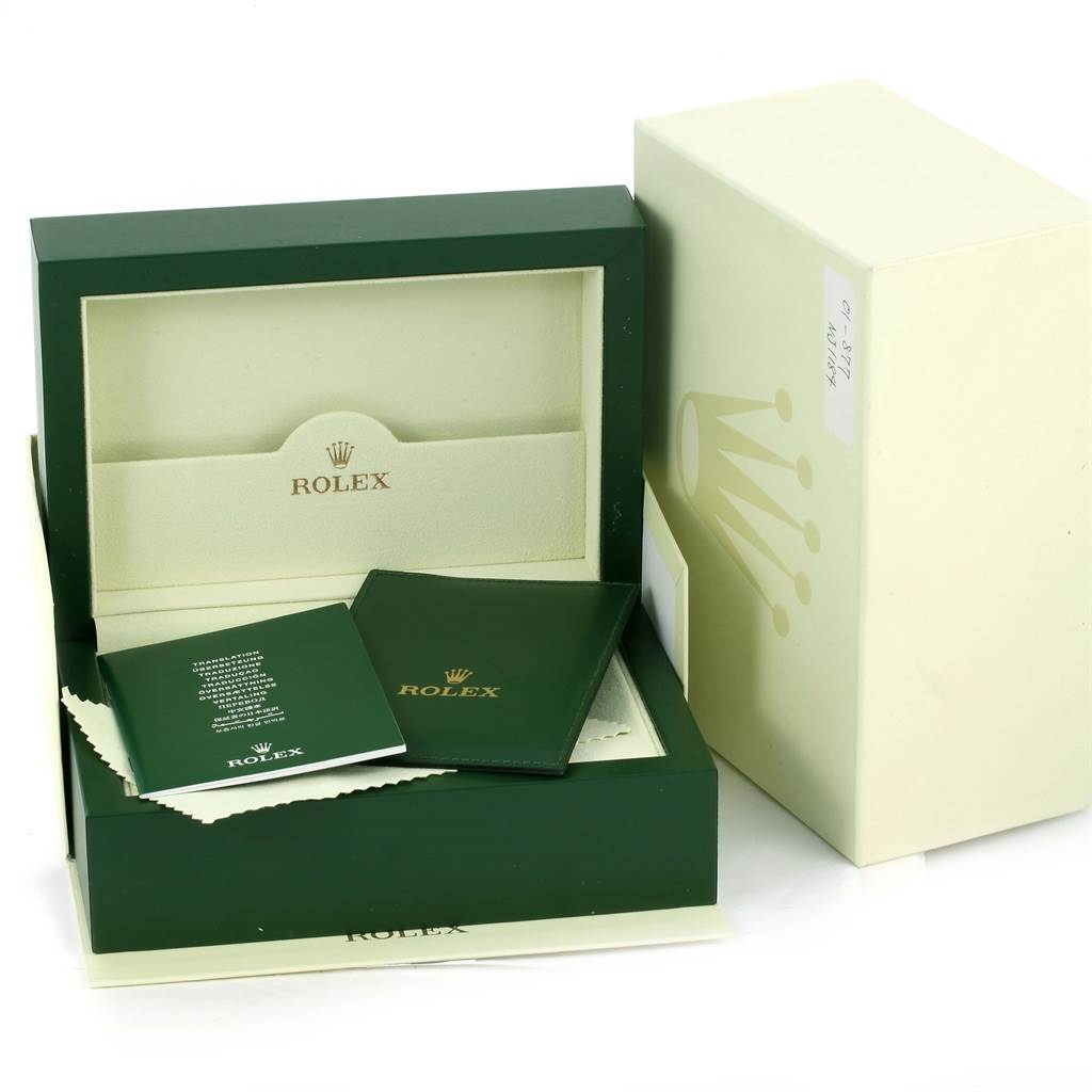 The image depicts the packaging and accessories for a Rolex GMT-Master 116710BLNR Men's Stainless Steel Black Dial 116710BLNR Men's Stainless Steel Black Dial watch, including the box, manuals, and polishing cloth.