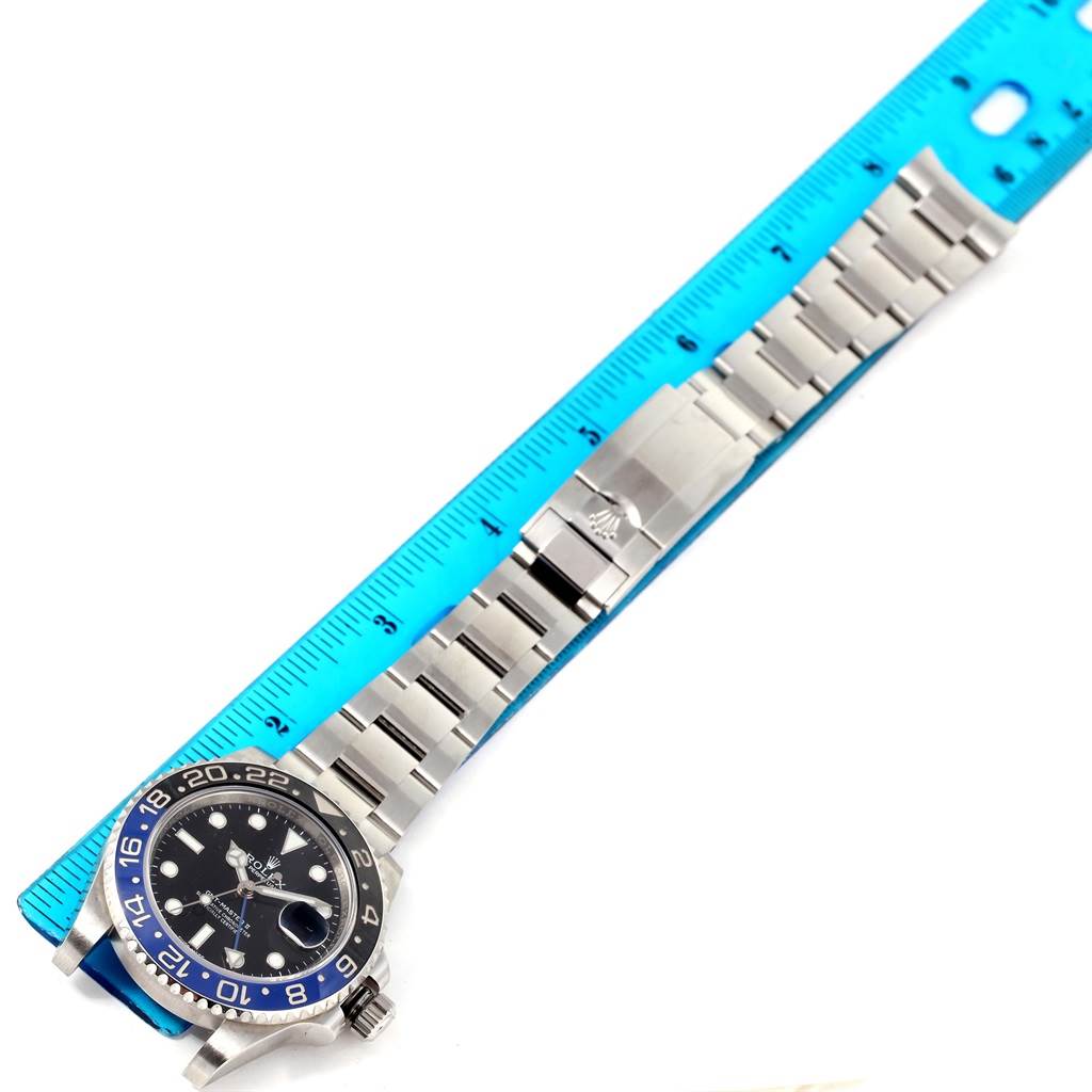 The image shows a side view of a Rolex GMT-Master 116710BLNR Men's Stainless Steel Black Dial 116710BLNR Men's Stainless Steel Black Dial watch, displaying the bezel, dial, and bracelet laid next to a ruler.