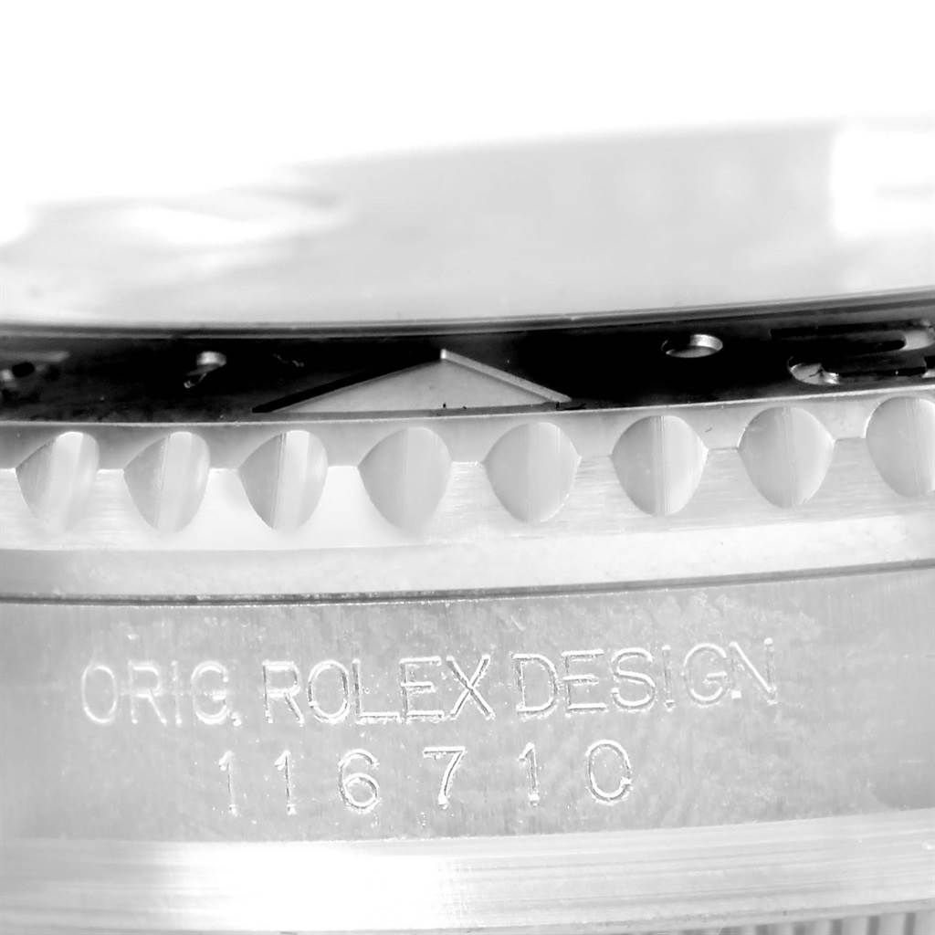 This close-up image of the Rolex GMT-Master 116710BLNR Men's Stainless Steel Black Dial 116710BLNR Men's Stainless Steel Black Dial shows the side of the case with the model number 116710 engraved.