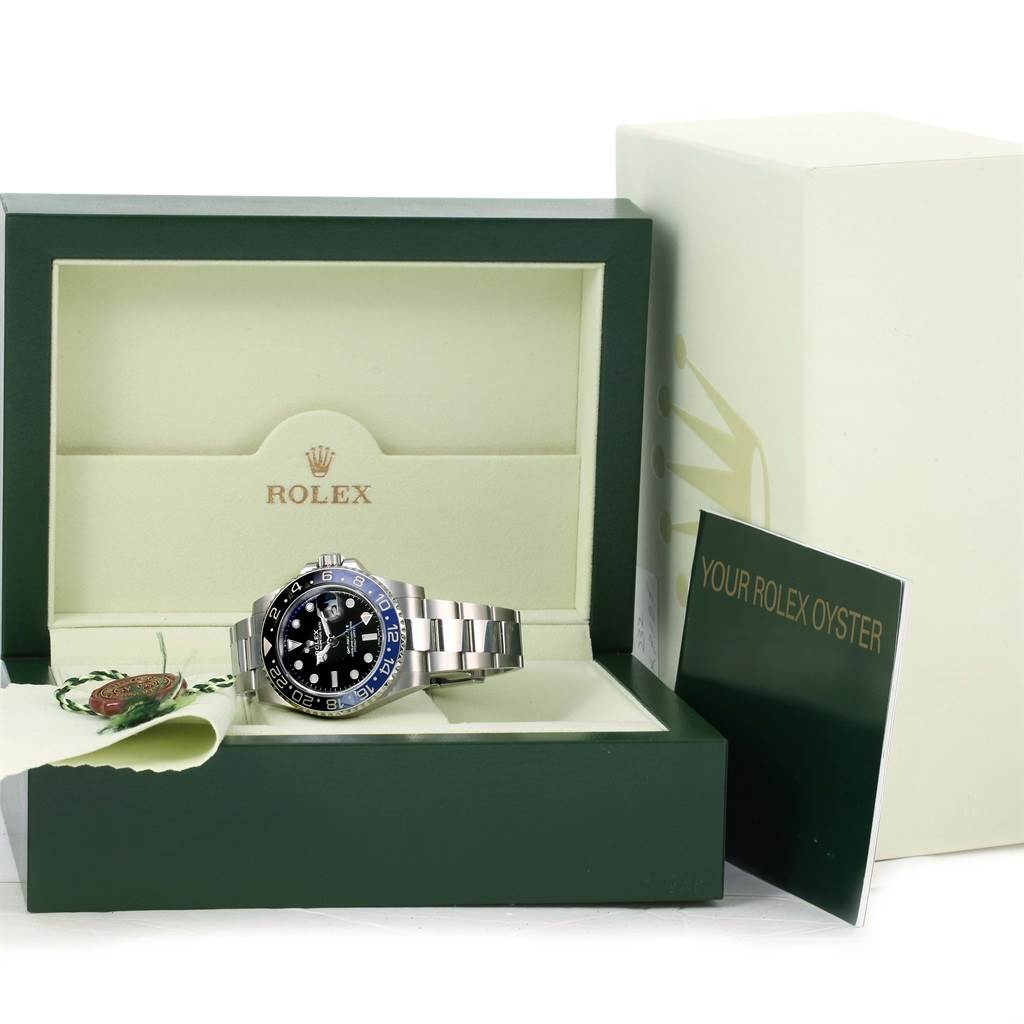 The image shows a Rolex GMT-Master 116710BLNR Men's Stainless Steel Black Dial 116710BLNR Men's Stainless Steel Black Dial watch from a front angle, with its box, booklet, and tags.