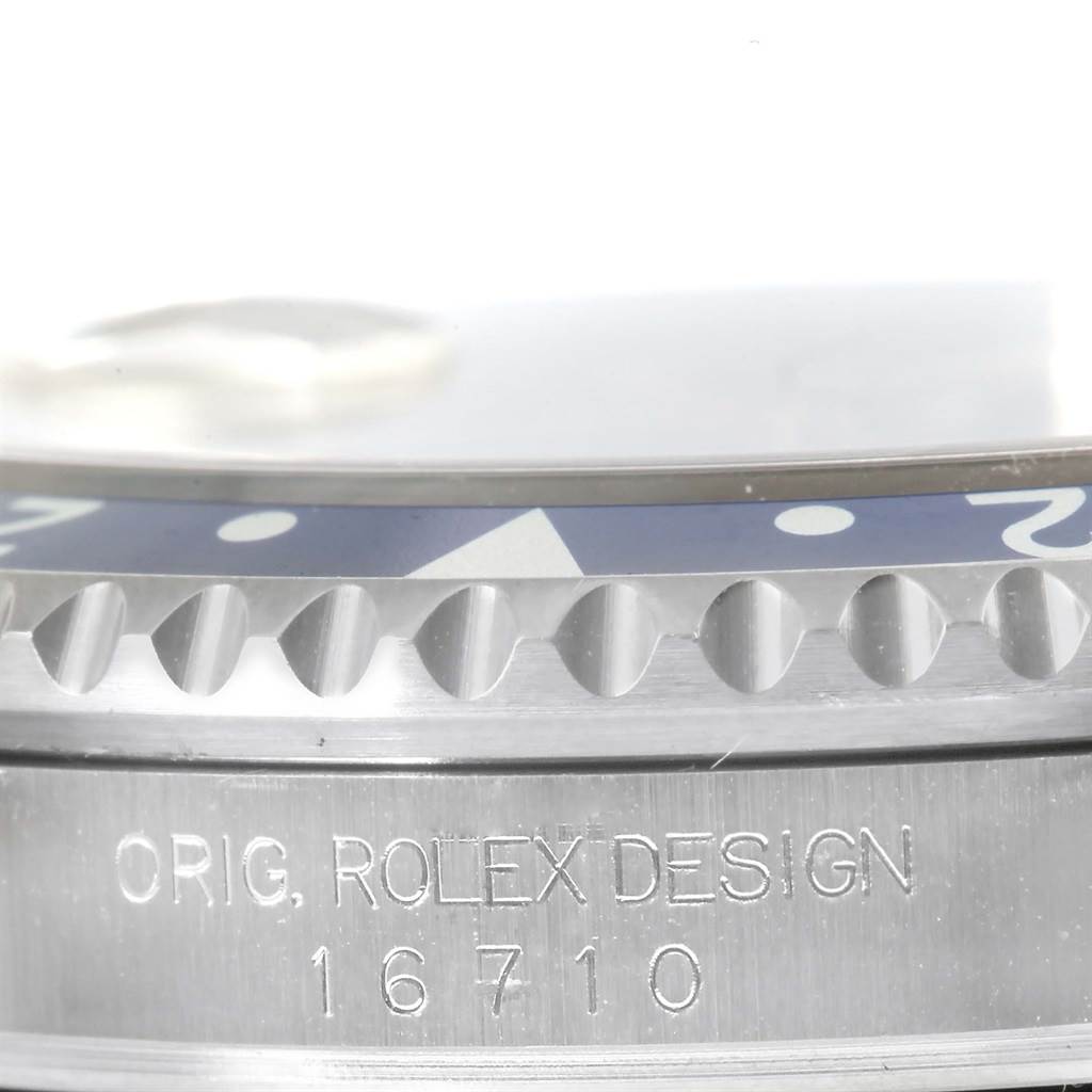 This is a close-up of the bezel and case side of a Rolex GMT-Master 16710 Men's Stainless Steel Black Dial 16710 Men's Stainless Steel Black Dial, showing the engraving "ORIG. ROLEX DESIGN" and the model number 16710.