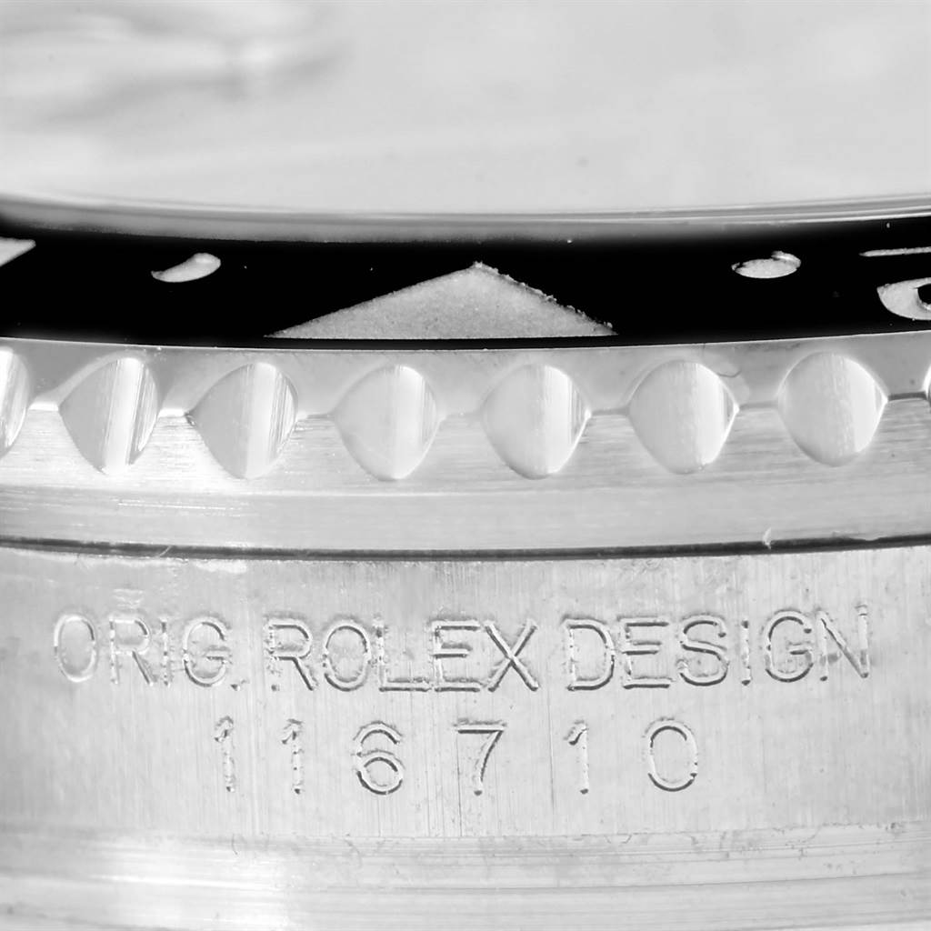 The image shows a close-up of the bezel and case side of a Rolex GMT-Master 116710 Men's Stainless Steel Black Dial 116710 Men's Stainless Steel Black Dial, with the model number 116710 engraved.