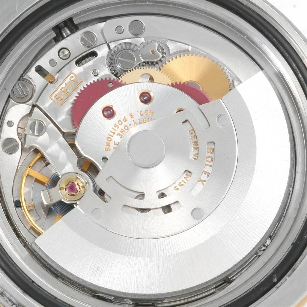 This image shows the movement and inner mechanics of a Rolex GMT-Master 116713 Men's Stainless Steel Black Dial 116713 Men's Stainless Steel Black Dial watch at a close-up angle.
