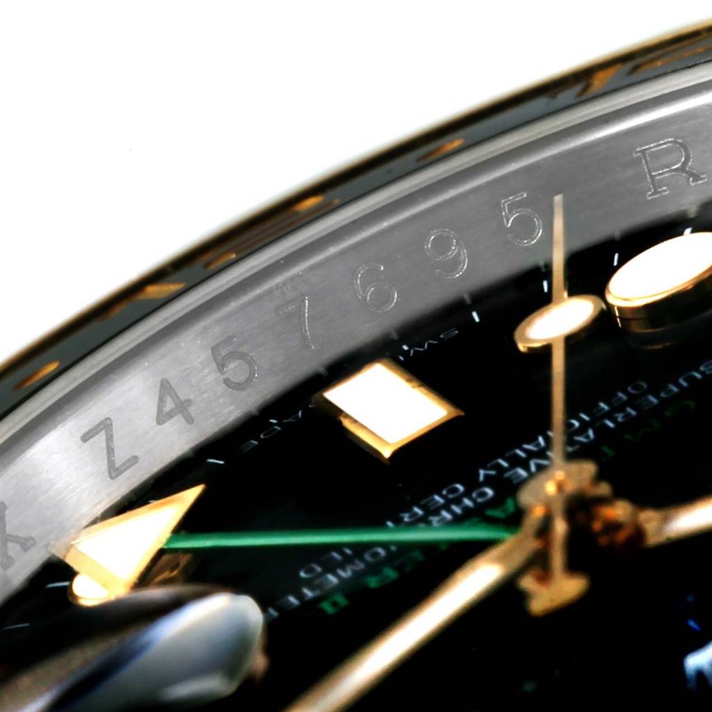Close-up of the dial edge, hands, and part of the bezel, showing serial numbers and markers of the Rolex GMT-Master 116713 Men's Stainless Steel Black Dial 116713 Men's Stainless Steel Black Dial watch.