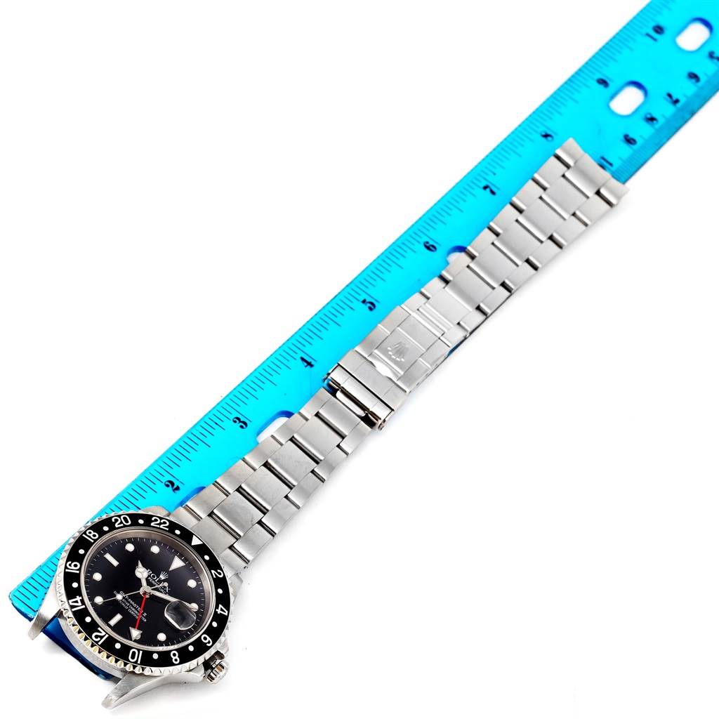 The image shows a top-down view of a Rolex GMT-Master 16710 Men's Stainless Steel Black Dial 16710 Men's Stainless Steel Black Dial watch, displaying its dial, bezel, and stainless steel bracelet.