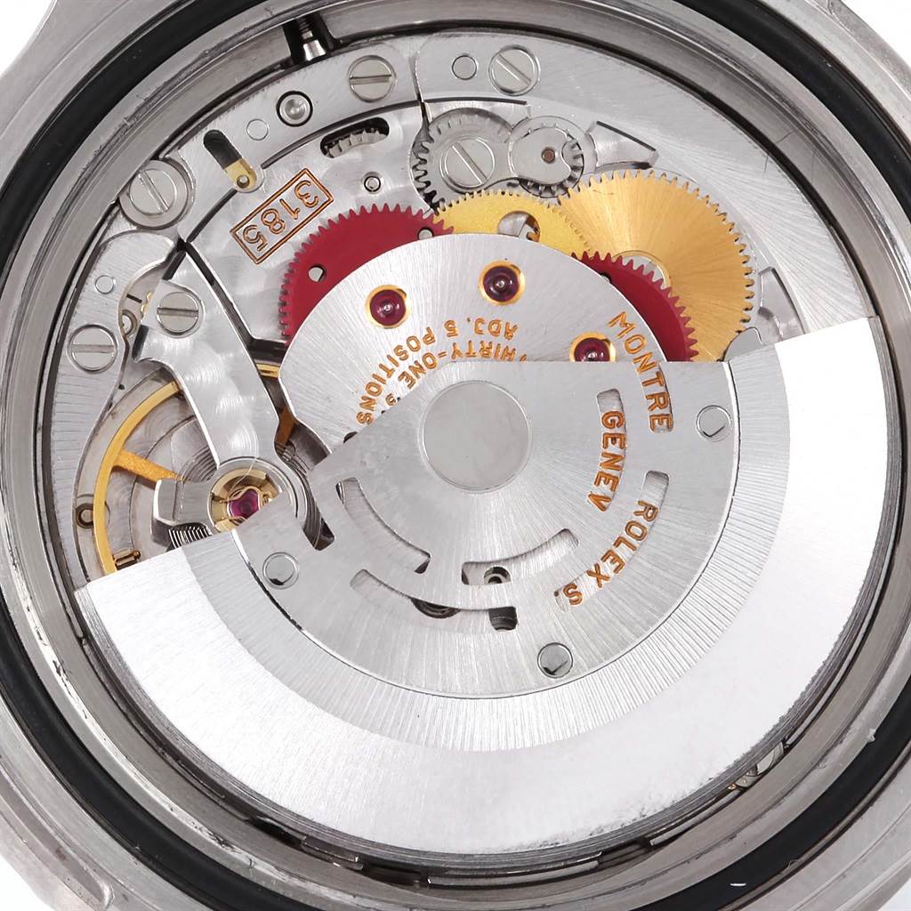 This image shows a close-up of the movement mechanism inside a Rolex GMT-Master 16710 Men's Stainless Steel Black Dial 16710 Men's Stainless Steel Black Dial watch.