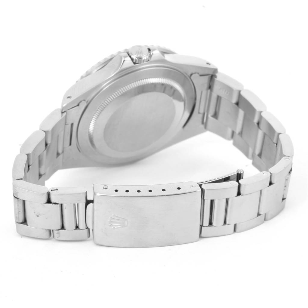 The image shows the back case and bracelet of a Rolex GMT-Master 16710 Men
s Stainless Steel Black Dial 16710 Men
s Stainless Steel Black Dial watch, including the clasp with the Rolex logo.