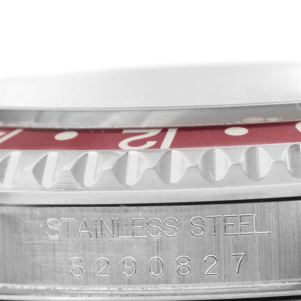 This is a close-up shot of the bezel and case side of a Rolex GMT-Master 16710 Men
s Stainless Steel Black Dial 16710 Men
s Stainless Steel Black Dial, showing the stainless steel inscription and bezel teeth.