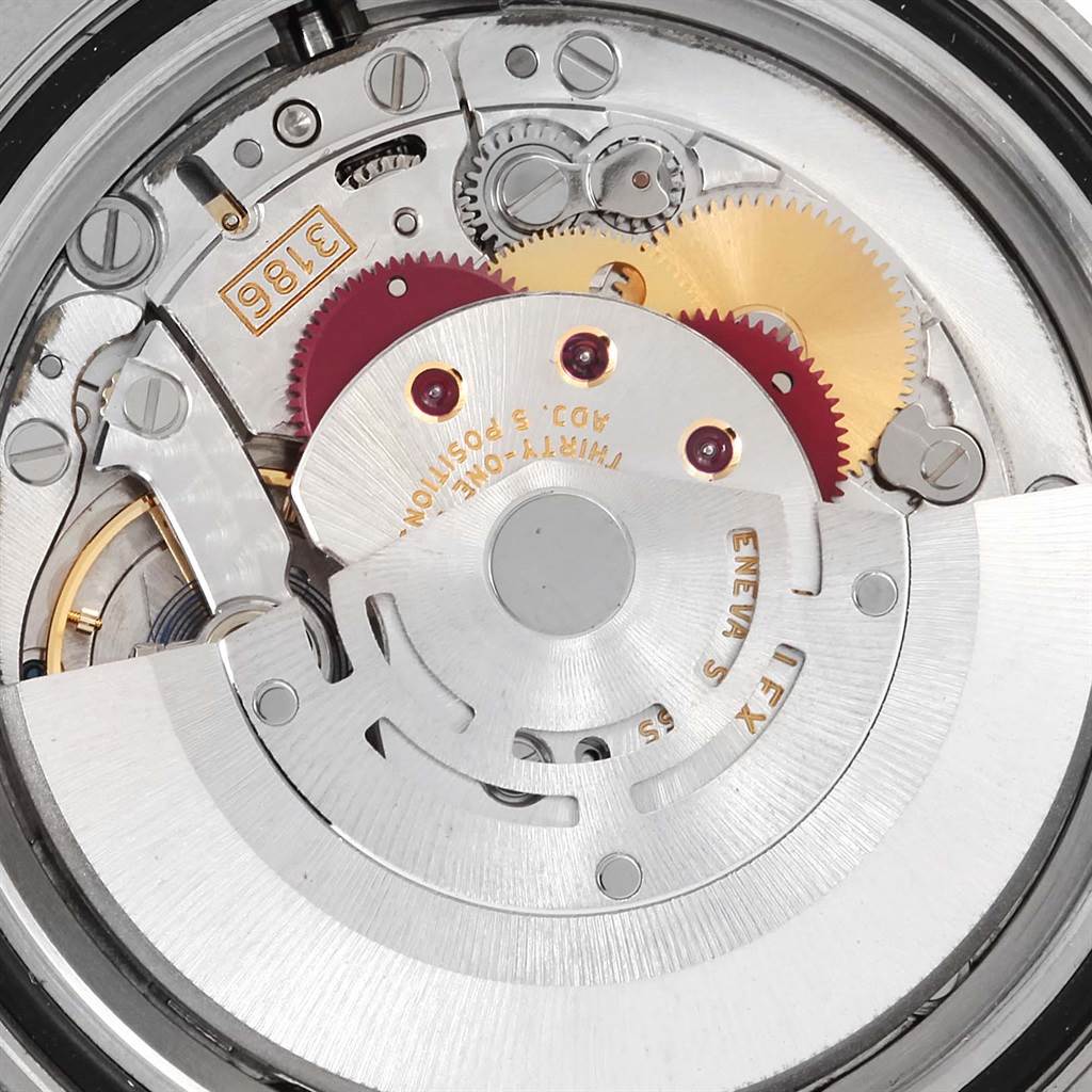 This image shows the internal movement components of a Rolex GMT-Master 116710 Men's Stainless Steel Black Dial 116710 Men's Stainless Steel Black Dial watch, including gears and the rotor.