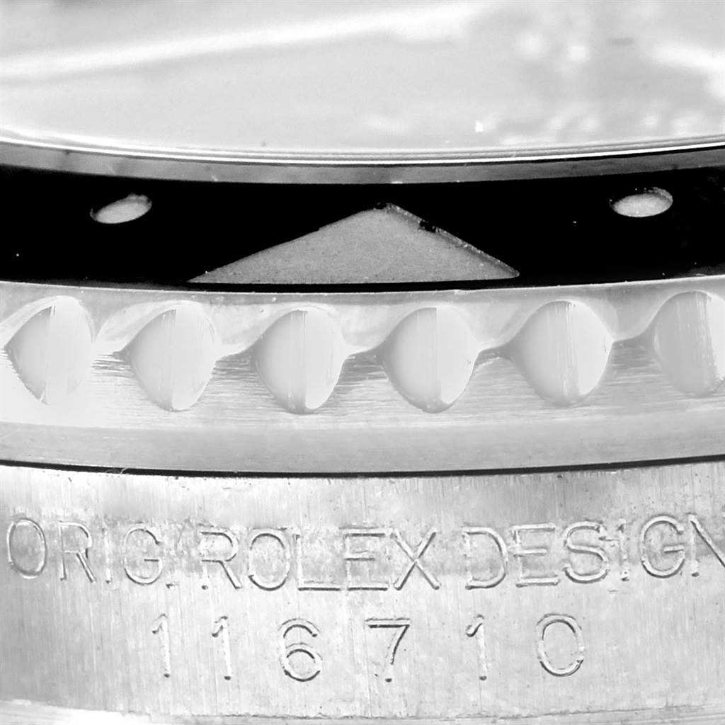 This close-up image shows the bezel and the engraved model number of the Rolex GMT-Master 116710 Men's Stainless Steel Black Dial 116710 Men's Stainless Steel Black Dial watch.