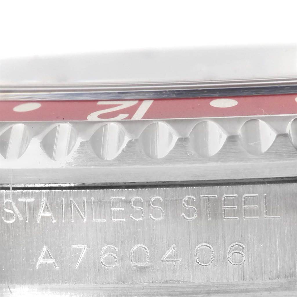 This close-up image shows the side of the Rolex GMT-Master 16710 Men's Stainless Steel Black Dial 16710 Men's Stainless Steel Black Dial watch, highlighting its stainless steel case and part of the bezel.