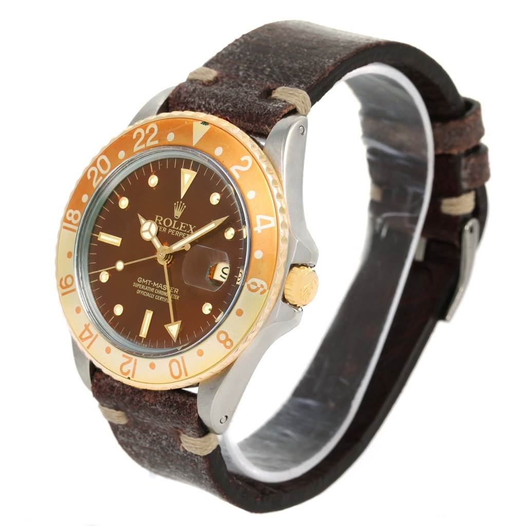 The image shows a side angle of the Rolex GMT-Master 16753 Men's Stainless Steel Brown Dial 16753 Men's Stainless Steel Brown Dial watch, highlighting its bezel, dial, and leather strap.