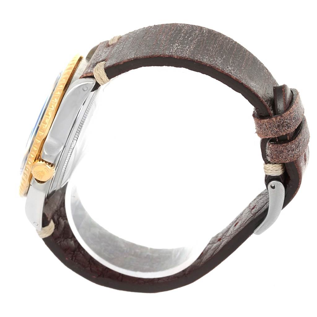 The image shows a side view of a Rolex GMT-Master 16753 Men's Stainless Steel Brown Dial 16753 Men's Stainless Steel Brown Dial watch with a gold bezel, visible crown, and brown leather strap.