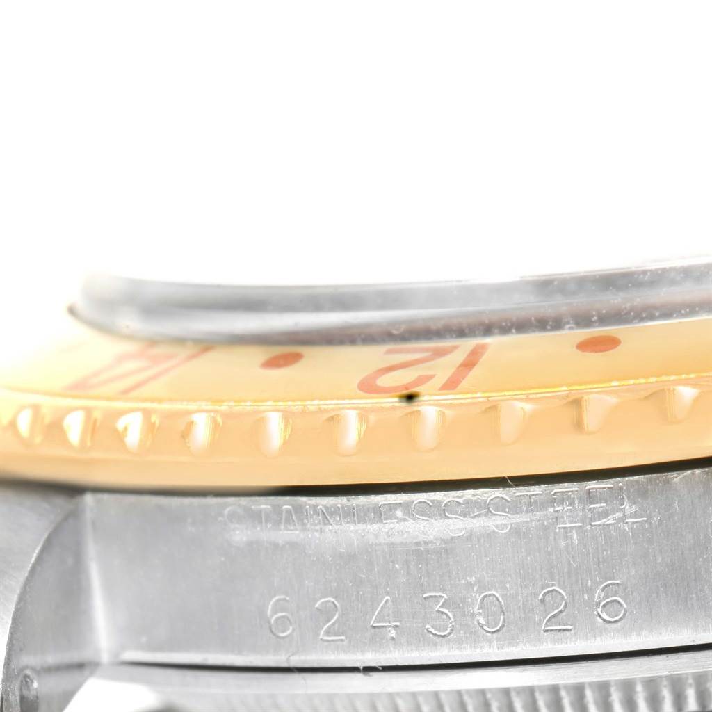 The image shows a close-up of the bezel and the case side of a Rolex GMT-Master 16753 Men's Stainless Steel Brown Dial 16753 Men's Stainless Steel Brown Dial watch, with part of the serial number visible.