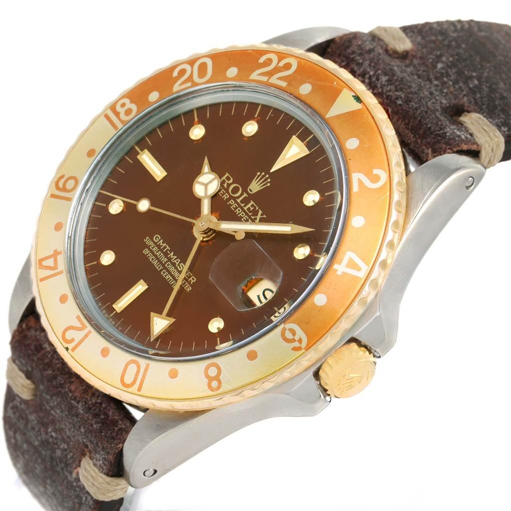 This Rolex GMT-Master 16753 Men's Stainless Steel Brown Dial 16753 Men's Stainless Steel Brown Dial watch is shown at a slight angle, highlighting the brown dial, gold-tone bezel, and leather strap.