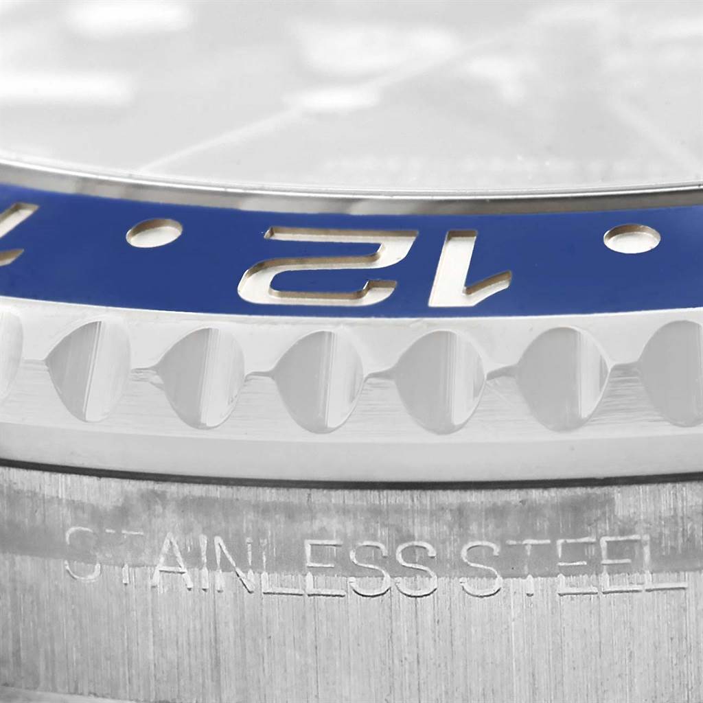 The image shows a close-up of the bezel and case edge of a Rolex GMT-Master 116710 Men's Stainless Steel Black Dial 116710 Men's Stainless Steel Black Dial watch, highlighting the "12" marker and stainless steel text.