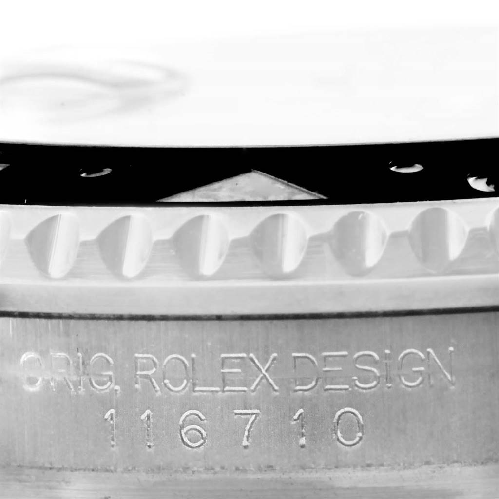 The image shows a close-up of the bezel and part of the case with the model number engraved for a Rolex GMT-Master 116710 Men's Stainless Steel Black Dial 116710 Men's Stainless Steel Black Dial watch.