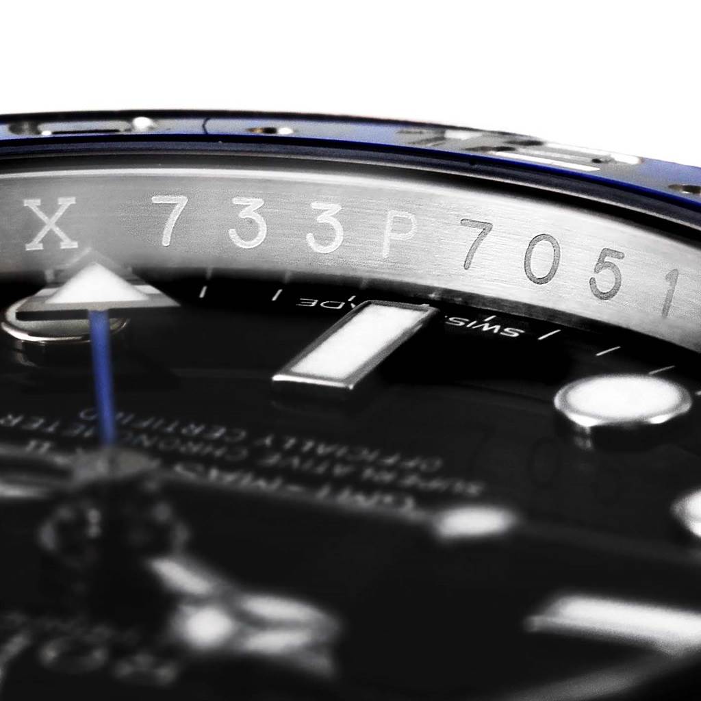 The image shows a close-up of the dial and rehaut of a Rolex GMT-Master 116710 Men's Stainless Steel Black Dial 116710 Men's Stainless Steel Black Dial watch, including the serial number engraving.