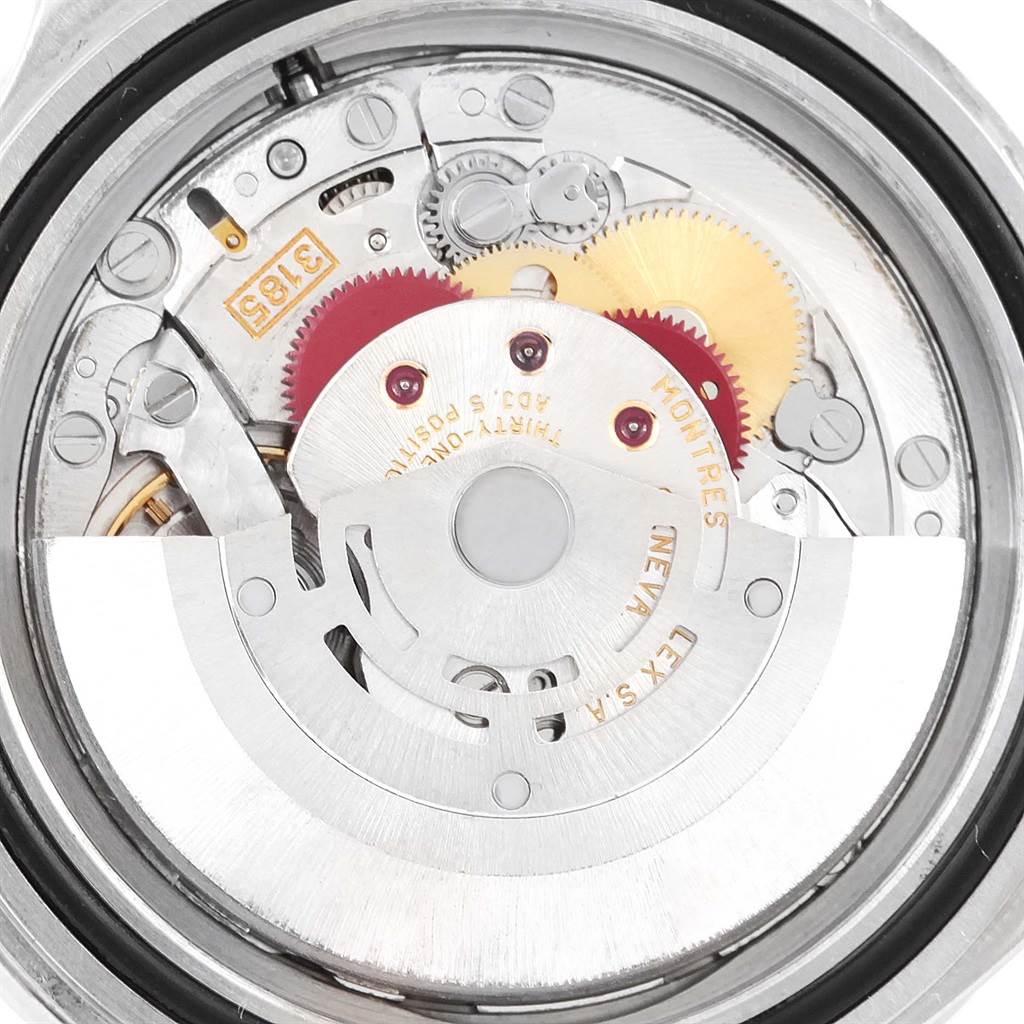 This image shows a close-up of the movement mechanism inside a Rolex GMT-Master 16710 Men's Stainless Steel Black Dial 16710 Men's Stainless Steel Black Dial watch, highlighting the gears and rotor.