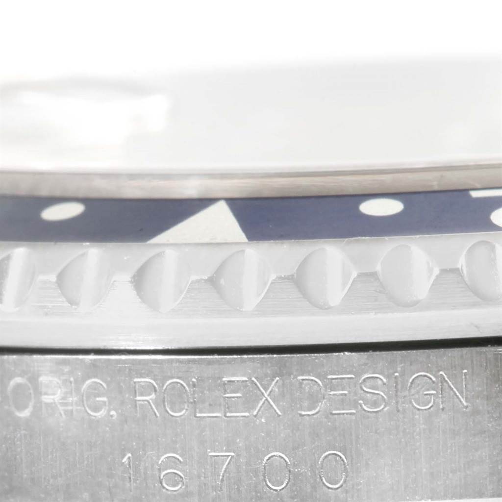 The image shows a close-up of the case side and bezel teeth of a Rolex GMT-Master 16700 Men's Stainless Steel Black Dial 16700 Men's Stainless Steel Black Dial model, including the engraved model number "16700."