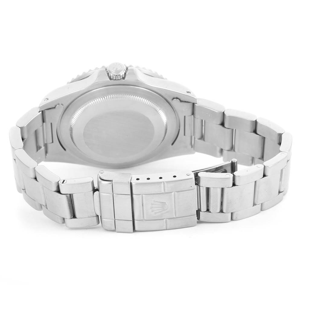 The image shows the back case, bezel, and clasp of a Rolex GMT-Master 16700 Men's Stainless Steel Black Dial 16700 Men's Stainless Steel Black Dial watch.