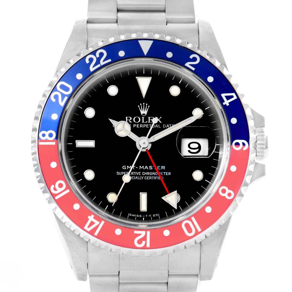 The image shows a front view of the Rolex GMT-Master 16700 Men's Stainless Steel Black Dial 16700 Men's Stainless Steel Black Dial watch, highlighting the dial, bezel, bracelet, and date feature.