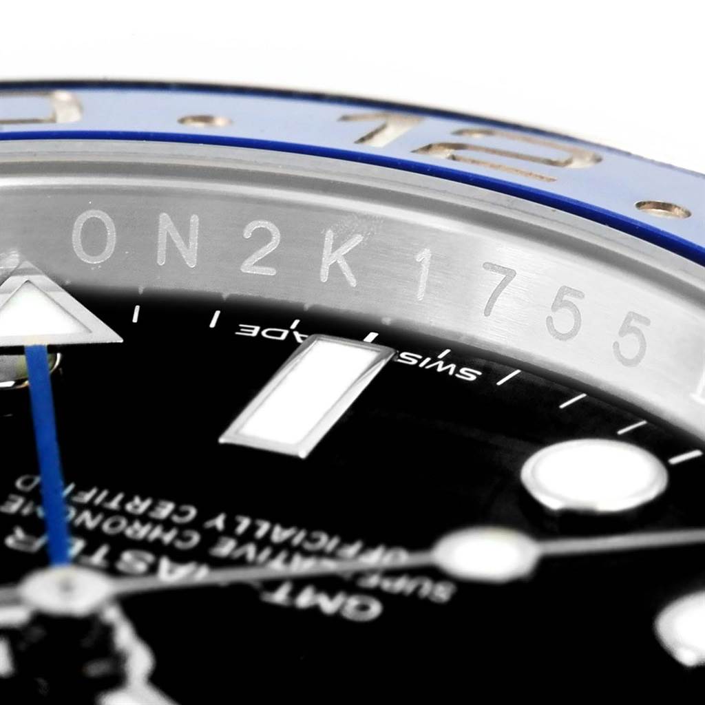 Close-up image of the bezel, dial, and part of the hands of a Rolex GMT-Master 116710 Men
s Stainless Steel Black Dial 116710 Men
s Stainless Steel Black Dial watch.