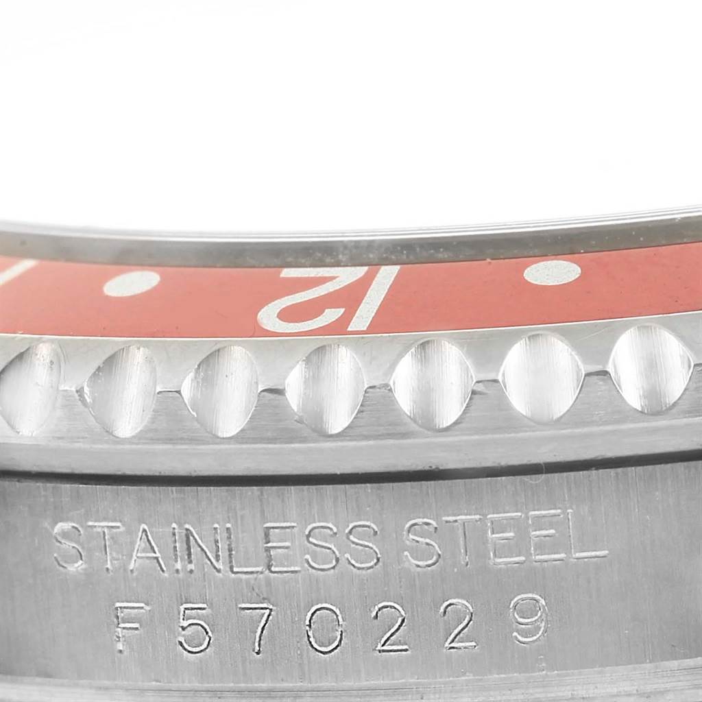 This close-up image shows the bezel and case side engraving of a Rolex GMT-Master 16710 Men's Stainless Steel Black Dial 16710 Men's Stainless Steel Black Dial watch.