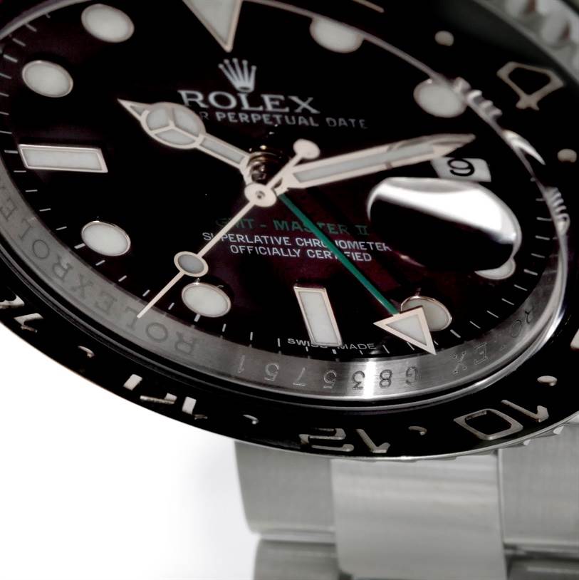 The image shows a close-up angle of the Rolex GMT-Master 116710 Men
s Stainless Steel Black Dial 116710 Men
s Stainless Steel Black Dial watch face, detailing the hands, bezel, and part of the bracelet.